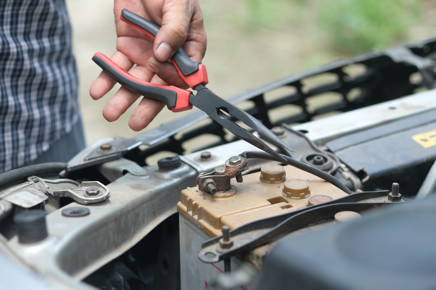 Servicing a battery terminal under the hood